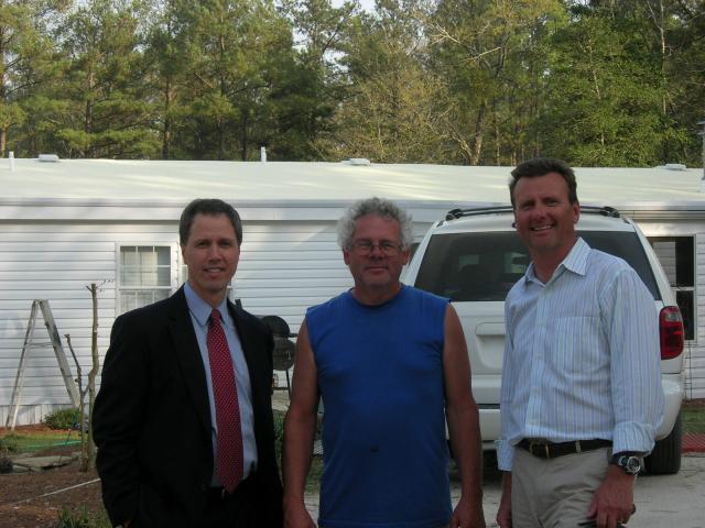 EESI's Jan Mueller with energy efficiency consultant Buddy DeLozer and homeowner Robert Hersey, whose home received an efficiency retrofit